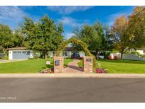 Beautiful home exterior with lush landscaping and brick walkway at 6030 E Calle Del Sud St, Scottsdale, AZ 85251