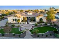 Luxury home with a circular driveway and landscaped yard at 4547 S Banning Dr, Gilbert, AZ 85297