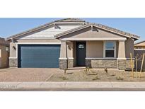 Charming single-story home with a well-manicured front yard and a blue garage door at 4820 N 177Th Dr, Goodyear, AZ 85395