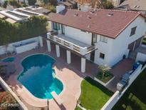 Aerial view of house with pool and backyard at 1302 E Steamboat Bend Dr, Tempe, AZ 85283