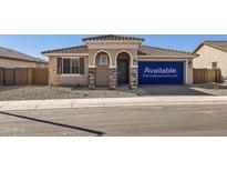 Charming single-story home featuring a tile roof and low-maintenance desert landscaping at 25347 N 176Th Ave, Surprise, AZ 85387