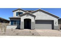 Beautiful two-story home with a two-car garage and stylish blue shutters at 43499 N Wollemi St, Queen Creek, AZ 85140