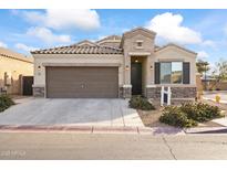 Inviting curb appeal featuring a two-car garage and well-manicured landscaping at 1703 N Hillcrest --, Mesa, AZ 85201