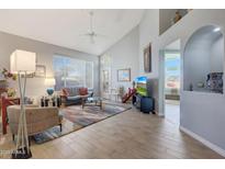 Bright living room featuring vaulted ceilings and tile floors at 23635 N 75Th Pl, Scottsdale, AZ 85255