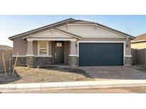 Charming single Gathering home featuring stylish stonework, a two-car garage, and a welcoming entryway at 17737 W Elm St, Goodyear, AZ 85395