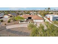Single-story home with a large yard and driveway at 1750 E Euclid Ave, Phoenix, AZ 85042
