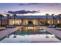 Luxury home showcases a serene backyard pool, lounge chairs, and sleek modern architecture at twilight at 6215 N Casa Blanca Dr, Paradise Valley, AZ 85253