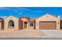 Charming single-story stucco home featuring a tile roof, attached garage, and desert landscaping at 7682 W Mockingbird Way, Florence, AZ 85132