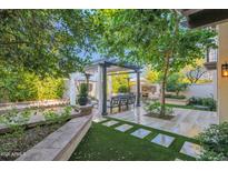 Relaxing backyard patio with pergola, seating area, and built-in grill at 6701 N Scottsdale Rd # 24, Scottsdale, AZ 85250