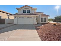 Two-story house with a two-car garage and landscaped front yard at 1705 E Windsong Dr, Phoenix, AZ 85048
