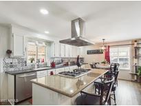 Modern kitchen with granite island, stainless steel appliances, and updated cabinetry at 2600 E Allred Ave # R87, Mesa, AZ 85204