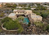 Large estate home with a pool and landscaped grounds in a secluded area at 15419 E Stardust Dr, Fountain Hills, AZ 85268