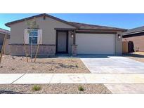 Charming single-story home featuring a two-car garage and low-maintenance front yard at 22489 W Pontiac Dr, Surprise, AZ 85387