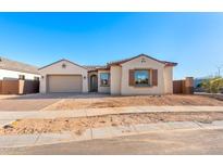 Charming single-story home featuring a two-car garage, tile roof, and neutral-toned stucco exterior at 24691 N 169Th Ave, Surprise, AZ 85387