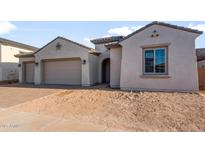 Charming single-Gathering home featuring a neutral-colored exterior, tile roof, and attached two-car garage at 24707 N 169Th Ave, Surprise, AZ 85387