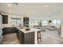 Modern kitchen with an island, stainless steel appliances, and an open concept layout perfect for entertaining and daily living at 2121 W Sonoran Desert Dr # 29, Phoenix, AZ 85085
