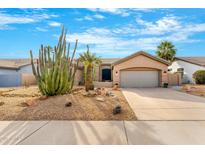 Desert landscape front yard with cacti and gravel at 6713 E Paradise Ln, Scottsdale, AZ 85254