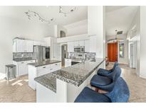 Spacious kitchen with granite countertops and island at 6713 E Paradise Ln, Scottsdale, AZ 85254