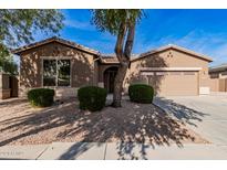 Single-story home with a two-car garage and landscaped front yard at 7578 W Keim Dr, Glendale, AZ 85303