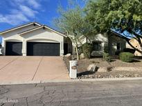 Beautiful home with 3-car garage, mature landscaping, and a long driveway at 15201 E Sage Dr, Fountain Hills, AZ 85268