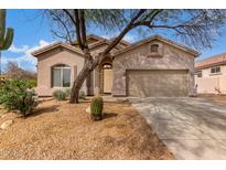Charming single-story home with desert landscaping, attached garage, and neutral color palette at 3055 N Red Mountain Mtn # 95, Mesa, AZ 85207