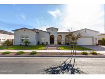 Single-story home with stucco exterior, landscaped yard, and attached garage at 18849 E Azalea Dr, Queen Creek, AZ 85142