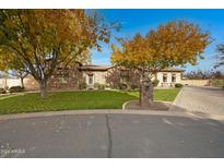 Stone house with autumn trees and paved driveway at 24002 S 201St Ct, Queen Creek, AZ 85142