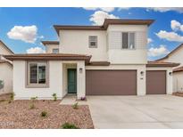 Charming two-story home with neutral colors, a three-car garage, and manicured landscaping at 4918 W Beryl Ave, Glendale, AZ 85302