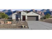 Charming single-story home featuring a two-car garage and low-maintenance desert landscaping at 1562 E Mason Dr, Casa Grande, AZ 85122