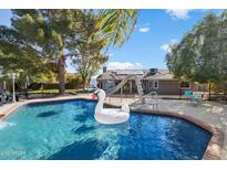 Inviting swimming pool with swan float and ample patio space at 24444 N 40Th Ln, Glendale, AZ 85310