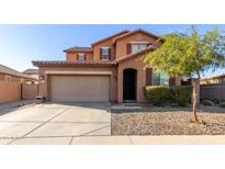 Two-story house with attached garage and landscaped front yard at 314 N 79Th Pl, Mesa, AZ 85207