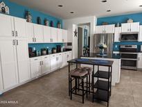 Spacious kitchen with ample cabinetry, an island, and stainless steel appliances at 400 W Wisteria Pl, Chandler, AZ 85248