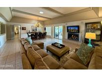 Bright and spacious living room featuring a fireplace, comfortable seating and dining area at 7343 E Marlette Ave, Scottsdale, AZ 85250