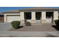 Single-story home with attached two-car garage and landscaped front yard at 8808 W State Ave, Glendale, AZ 85305