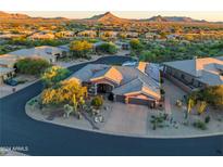 Luxury home with desert landscaping and mountain views at 9771 E Roadrunner Dr, Scottsdale, AZ 85262