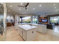 U-shaped kitchen island with stainless steel appliances and views to the Gathering room at 9771 E Roadrunner Dr, Scottsdale, AZ 85262