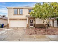 Two-story house with attached garage and landscaped front yard at 11526 W Scotts Dr, El Mirage, AZ 85335