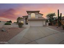 Two-story home with a landscaped front yard and a two-car garage at 2871 S Los Altos Pl, Chandler, AZ 85286