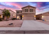 Two-story house with a large driveway and landscaped front yard at 30052 N Desert Willow Blvd, San Tan Valley, AZ 85143