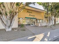 Royal Rivera apartment building entrance with mature trees and landscaping at 3655 N 5Th Ave # 115, Phoenix, AZ 85013