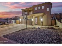 Two-story house with a large driveway and basketball hoop at 13032 N 19Th St, Phoenix, AZ 85022