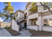 Attractive exterior of a two-story condo building with stairs leading to entrance at 1941 S Pierpont Dr # 2098, Mesa, AZ 85206