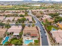 Aerial view showing a house with a pool and surrounding neighborhood at 7710 E Monica Dr, Scottsdale, AZ 85255