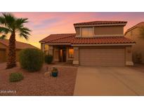 Inviting two-story home with a terracotta tile roof and desert landscaping at 5951 E Trailridge St, Mesa, AZ 85215