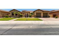 Charming single-Gathering home featuring a well-maintained front yard and inviting curb appeal at 14539 W Sheridan St, Goodyear, AZ 85395