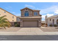 Two-story house with attached garage and desert landscaping at 16657 S 21St St, Phoenix, AZ 85048
