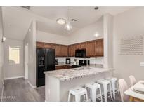 Modern kitchen with granite countertops and stainless steel appliances at 2402 E 5Th St # 1587, Tempe, AZ 85288