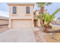 Two-story house with a large garage and mature palm trees in the front yard at 3555 S Payton St, Mesa, AZ 85212