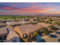 Aerial view of a luxury home community with mountain views and golf course at 1351 E Artemis Trl, Queen Creek, AZ 85140