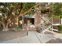 Exterior view of condo building with stairs and landscaping at 16602 N 25Th St # 215, Phoenix, AZ 85032